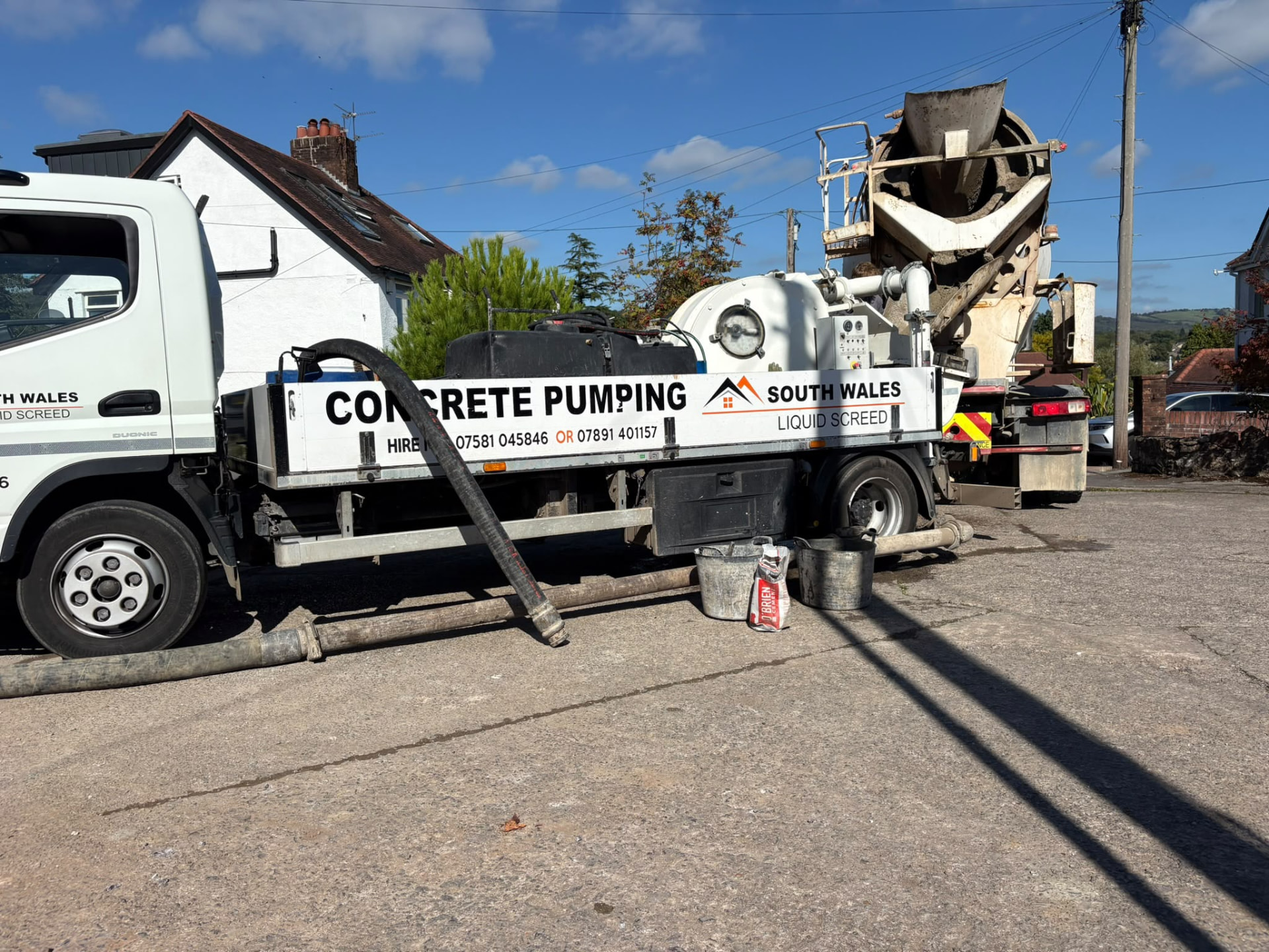 South Wales Liquid Screed branded pump rig on a Cardiff site delivering a flowing screed pour