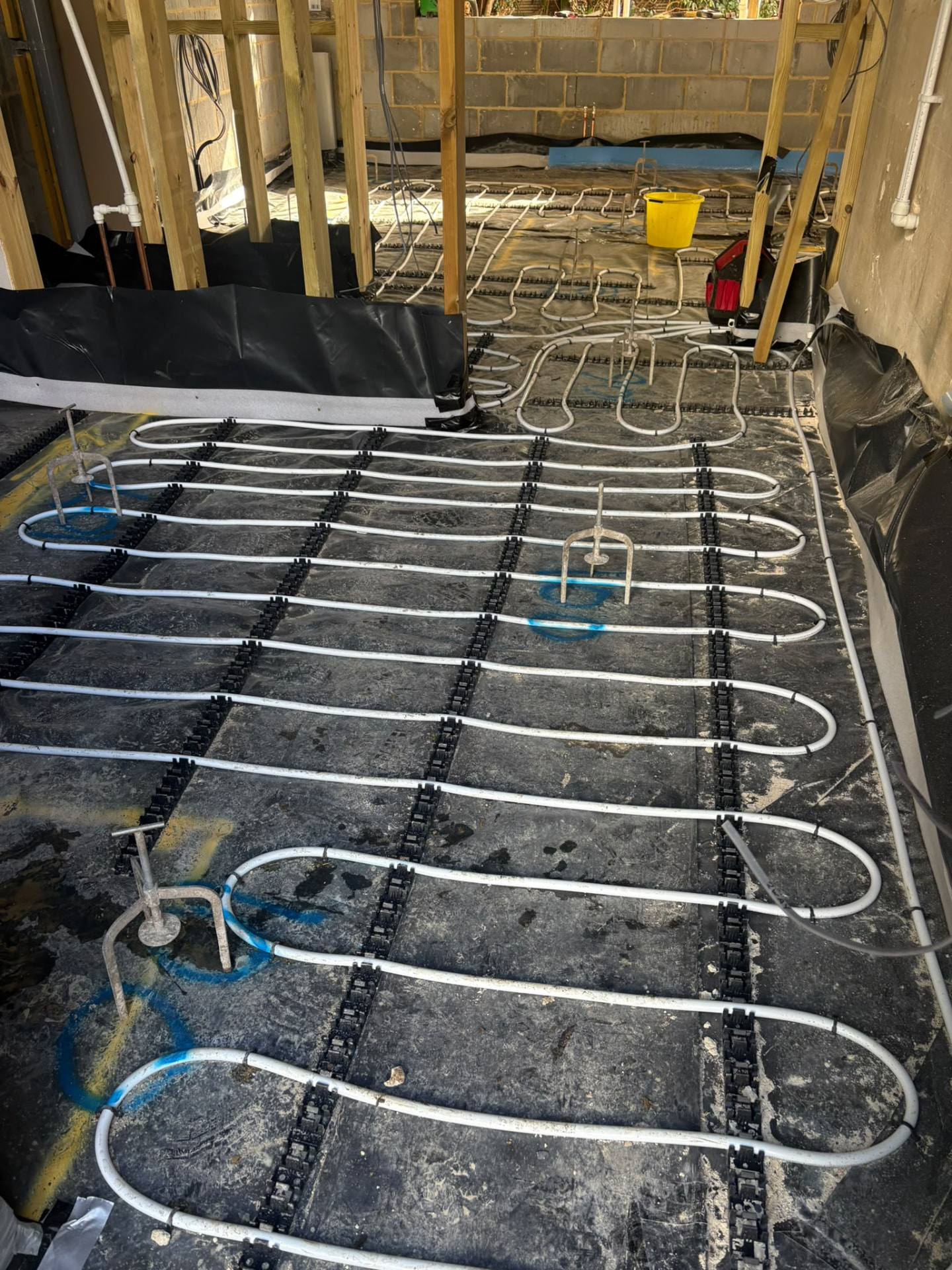 Underfloor heating pipework laid ready for liquid screed