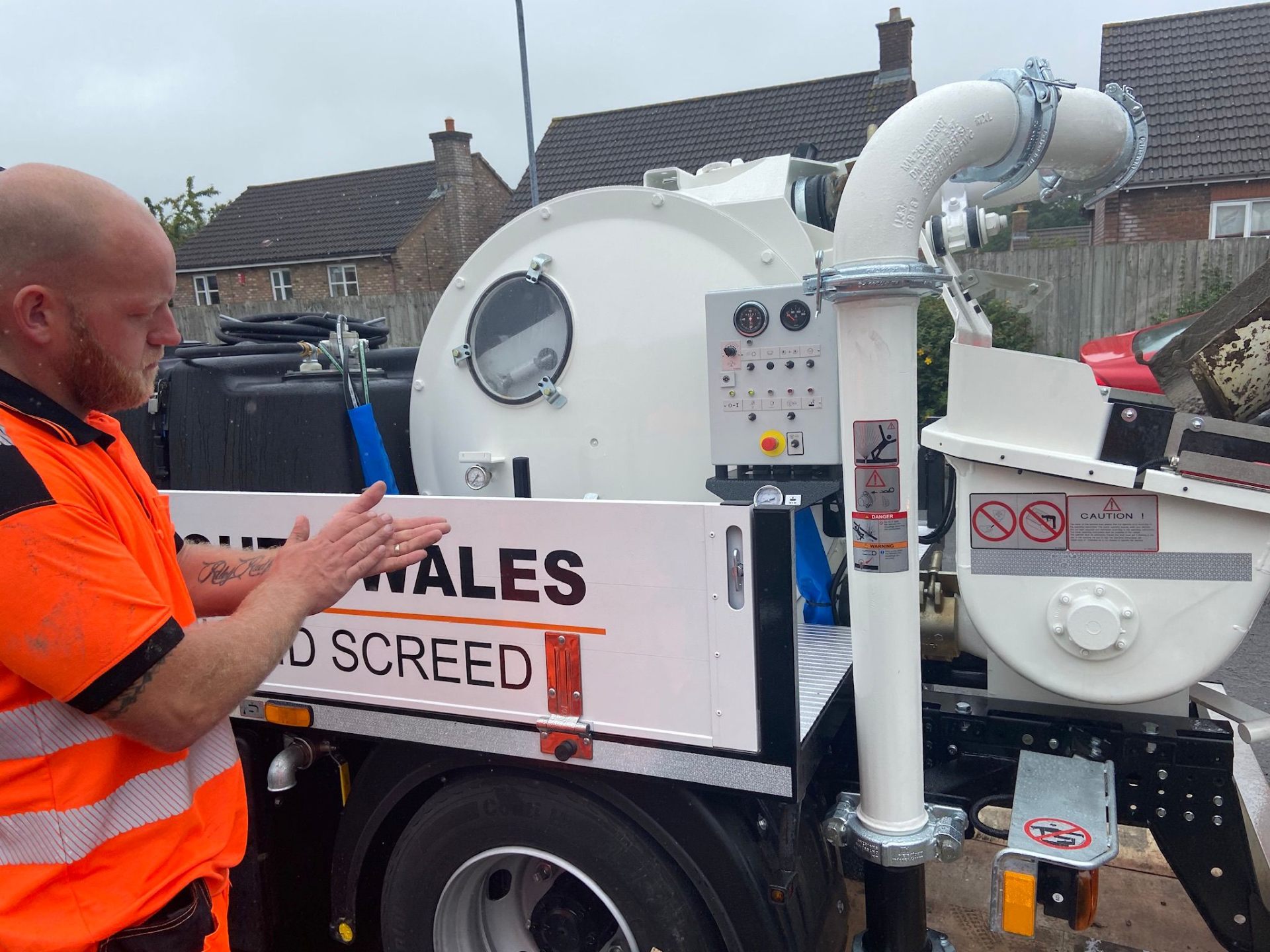 Operator inspecting a fresh delivery on the pump platform