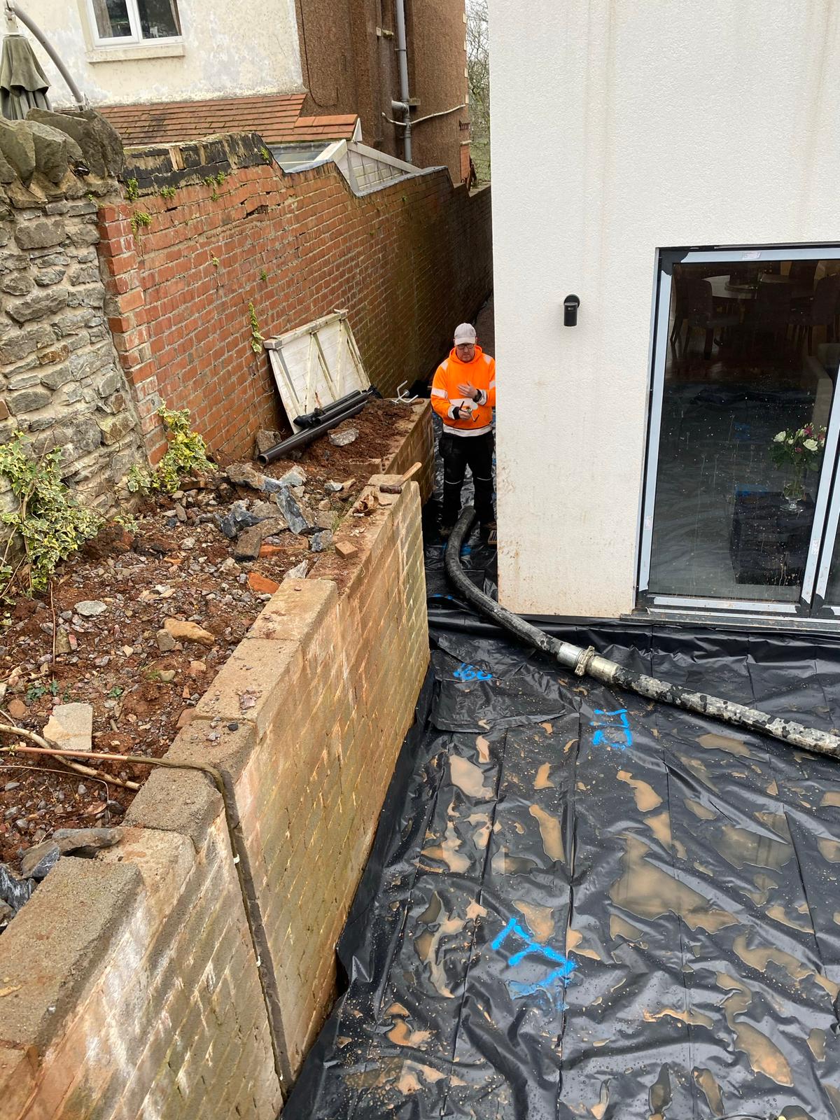 Underfloor heating pipework around door threshold reveal