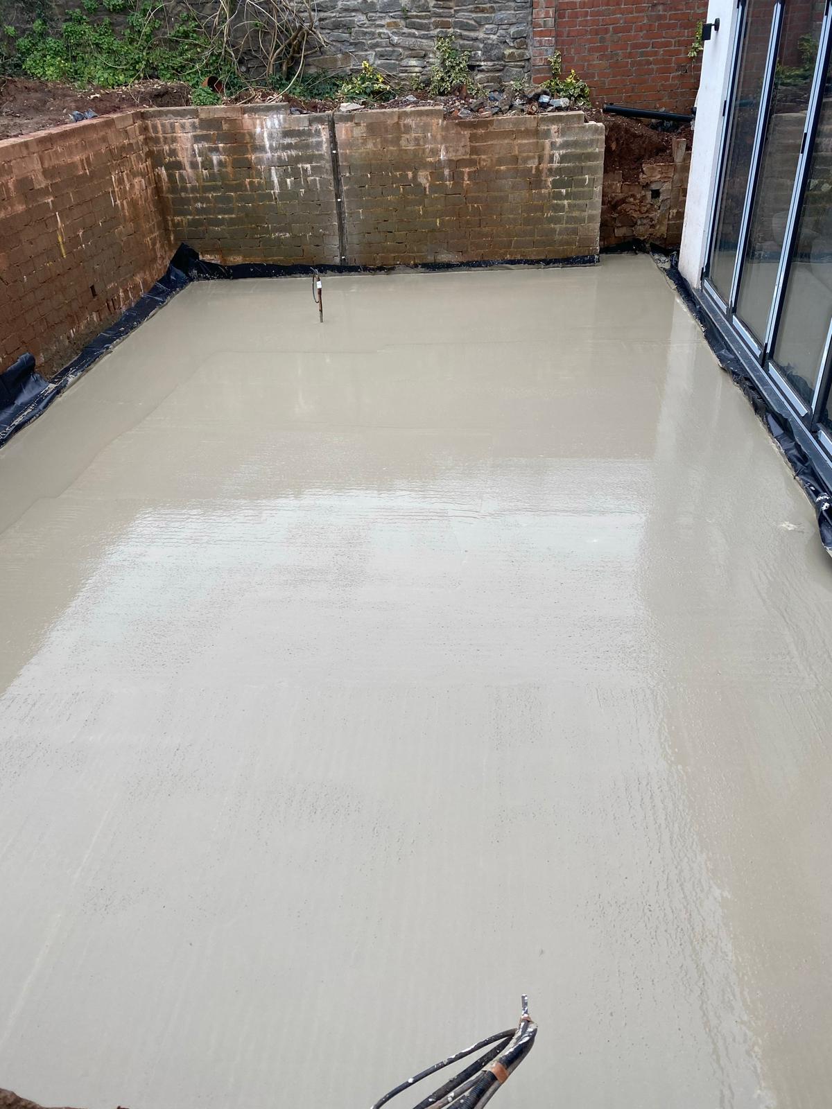 Ready-mix concrete poured into foundation trenches