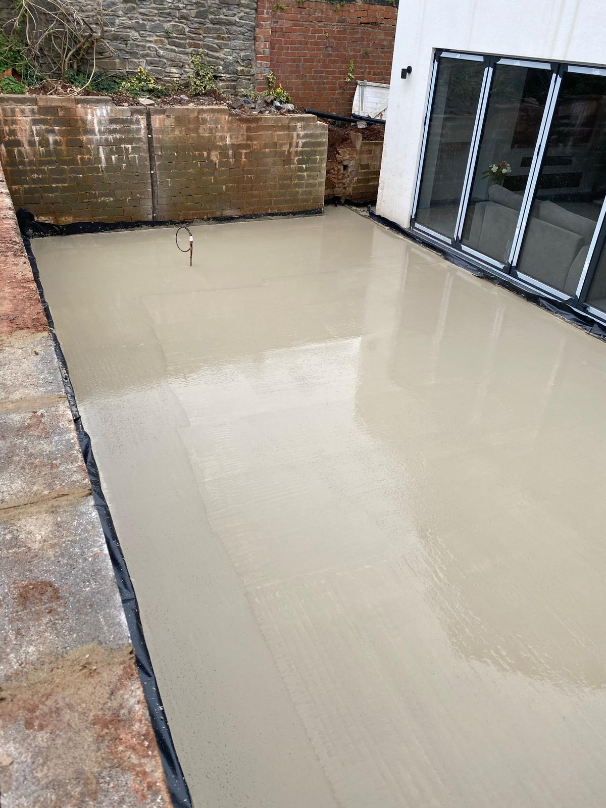 Concrete pour in progress on a garden extension footing