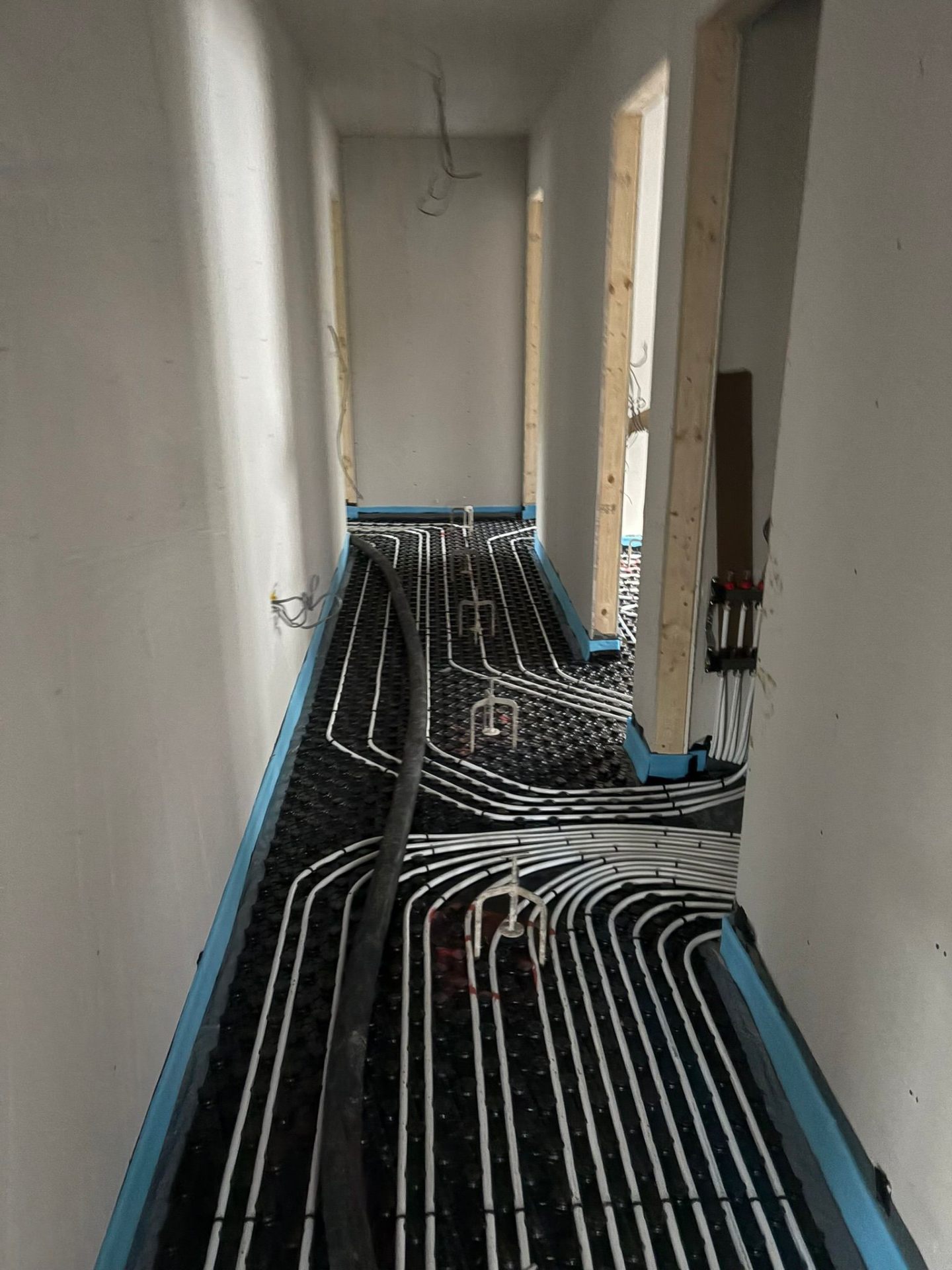 Underfloor heating in a hallway running to the manifold